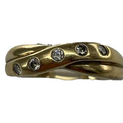 A 14kt yellow gold band with a diagonal row of five diamonds, size 10, 2.8 dwt.
