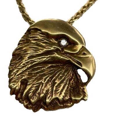 A 14kt eagleâ€™s head pendant with diamond eye and 14kt chain. Hidden bale. Eagle 1 1/8â€, 6.1 dwt. Chain 20â€, 7.1 dwt. 