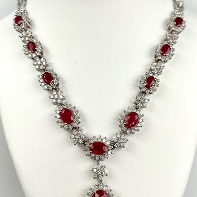 An 18kt white gold necklace with rubies and diamonds. Rubies show evidence of heating. Sparkly and bright, with push button clasp having...
