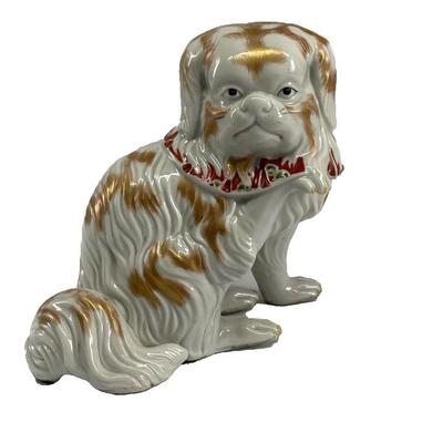 "Japanese Meiji period porcelain okimono seated chin dog with one paw raised. Fine molded porcelain with gilt accents, red and green...