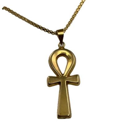 A tested 18kt gold Egyptian ankh or key of life pendant, 1 7/8â€ to top of bale, 2 dwt and a stamped 750 yellow gold chain, 24 3/4â€...