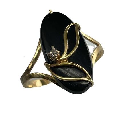 A yellow gold ring with wrapped with leaf design surrounding an oval black onyx with single Diamond. and a single diamond. Size 10 1/2,...