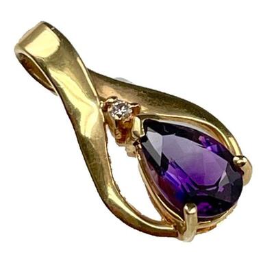 A 14kt yellow gold amethyst and diamond pendant, 1â€ length, 1.4 dwt and a stamped 14KT ITALY chain, 17 3/4â€ length, 1.3 dwt.Includes...
