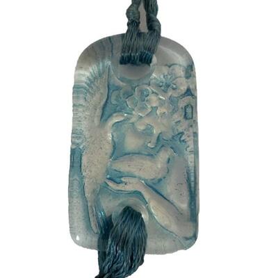 R. Lalique Opalescent Glass â€œColombesâ€ pendant with blue patina on blue silk cord. Image of a maiden with doves. Circa: 1920. Size: 1...