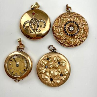 "Lot of four items including:
An Art Nouveau locket, the front cover with a chain of dragonflies and central rhinestones (missing a...