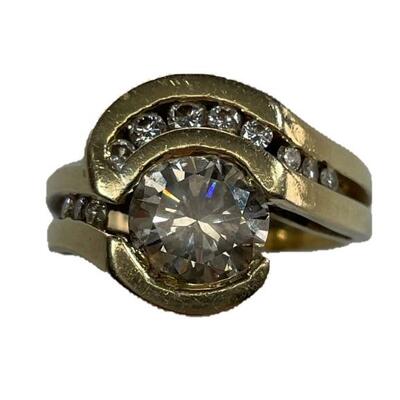 "A 14kt yellow gold ring with one center half bezel set round brilliant diamond, dimensions 8.30-8.30x5.14mm* measurements estimated...