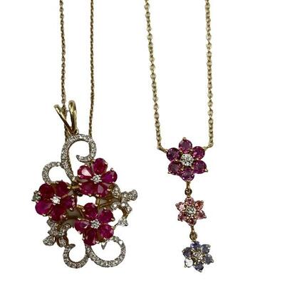 "Includes:

A stamped 14kt yellow gold chain necklace with attached multi gemstone and diamond pendant, having three sparkly multi...
