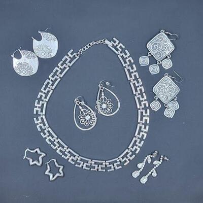 Trafari and silver tone jewelery