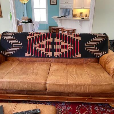 Awesome durable leather couch w matching chair & ottoman! Priced to go quick! 