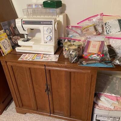 New Home sewing machine in cabinet