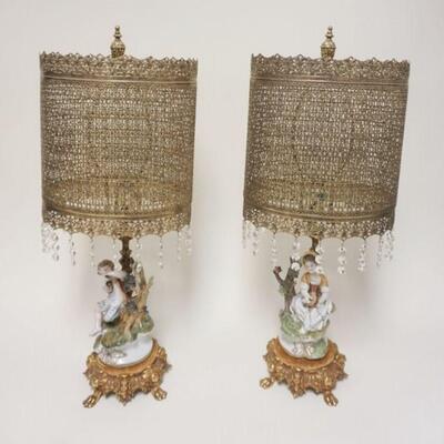 1012	FIGURAL TABLE LAMPS W/ UNUSUAL PIERCED METAL SHADES & BRASS BASE THAT IS FOOTED W/ CHERUBS APP. 25 IN H 
