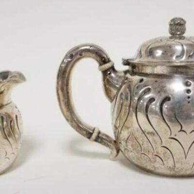 1009	STERLING SILVER TIFFANY & CO. TEAPOT & CREAMER, INSCRIBED UNDERNEATH & DATED 1894 16.2 TROY OUNCES 
