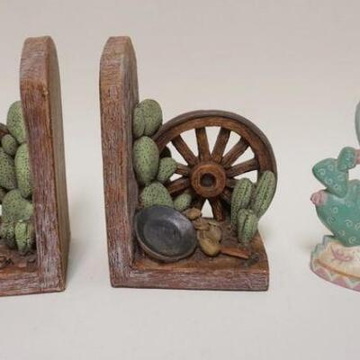 1063	LOT OF SOUTHWESTERN, IRON CACTUS DOOR STOP, POTTERY WAGON WHEEL BOOKENDS
