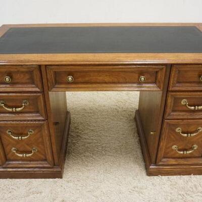 1025	OAK 7 DRAWER DESK W/LEATHER TOP, APPROXIMATELY 50 IN WIDE X 23 IN DEEP X 30 IN HIGH
