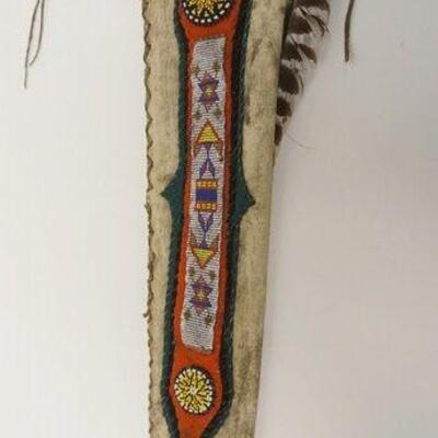 1057	VINTAGE NATIVE AMERICAN BEADED QUIVER, W/ARROW W/STONE ARROWHEAD, APPROXIMATELY 28 IN LONG
