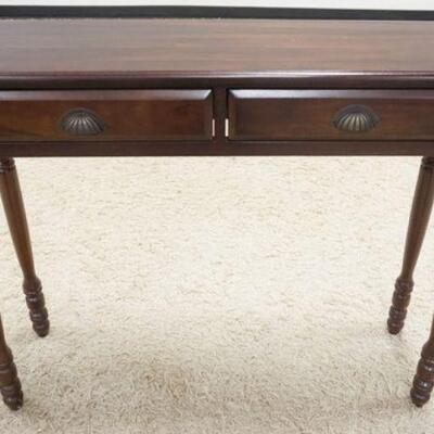 1033	NARROW WALNUT FINISH TWO DRAWER HALL TABLE. APP.  42 IN W X 13 IN DEEP X 34 IN H 
