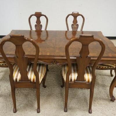 1031	KARGES WALNUT FRENCH PROVINCIAL TABLE W/ ONE LEAVE & SIX CHAIRS. SOME STAINING ON UPHOLSTERLY. TABLE APP. 61 IN X 48 IN X 30 IN H 
