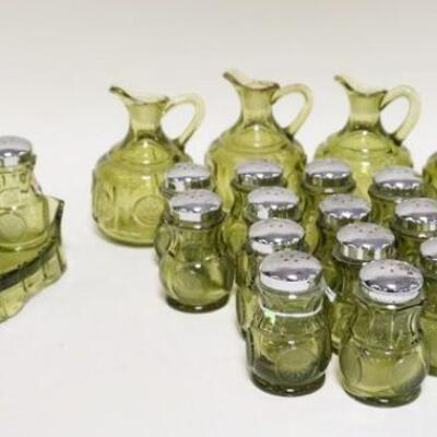 1097	FOSTORIA OLIVE GREEN CONDIMENT SET PLUS 16 EXTRA SALT & PEPPER SHAKERS & 5 PITCHERS 4 ARE MISSING STOPPERS. STOPPERS HAVE DAMAGE

