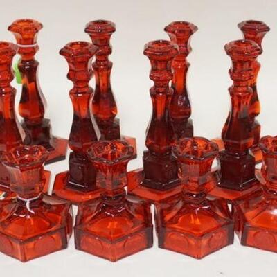 1087	15 RUBY RED FOSTORIA COIN GLASS CANDLE STICKS, TWO SIZES. TALLEST 8 IN H 
