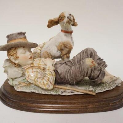 1065	G ARMANI FIGURE OF YOUNG BOY SLEEPING W/HIS DOG, APPROXIMATELY 12 IN LONG X 8 IN HIGH
