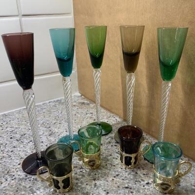 (9) Colored Crystal: 5- Long Twist Stem Cordials, &       4- Liqueur Glass set in Brass Handled Holders