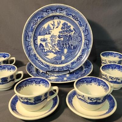 (10) Vintage Blue Willow Dishes of Various Makers:
2-Dinner Plates, Unmarked
6-Teacups, Jackson Custom China, Falls Creek PA
2-Saucers,...