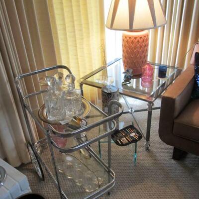 Stunning vintage mid-century chrome & glass bar cart, w/ vintage crystal decanters & silver plated accents. Also, one of a pair...