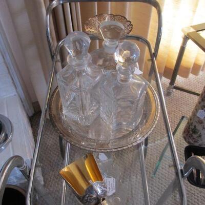 Stunning vintage mid-century chrome & glass bar cart, w/ vintage crystal decanters & silver plated accents.