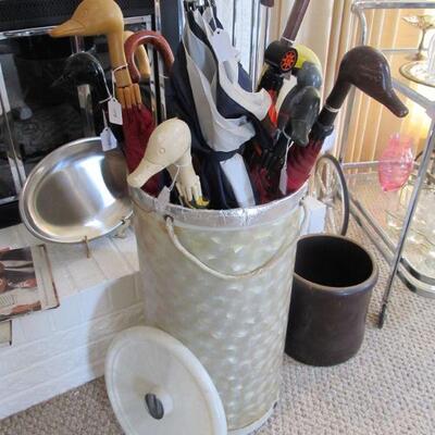 A grouping of vintage duck umbrellas that are of very nice quality. Also, a vintage TUPPERWARE laundry basket w/ lid.