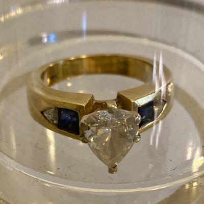 Diamond flanked by sapphires