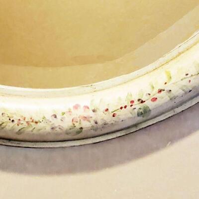 detail of painted oval mirror