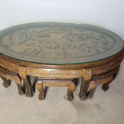 Teak carved oriental table with 6 nesting chairs