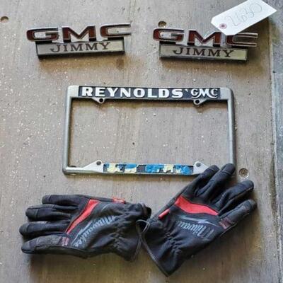 #2630 â€¢ GMC License Plate, Emblems and Milwaukee L Gloves  GMC License Plate, Emblems and Milwaukee L Gloves