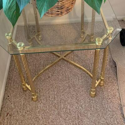Gold tone tables we have a pair