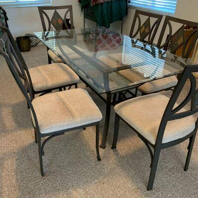 Glass top dinning room table and 6 chairs