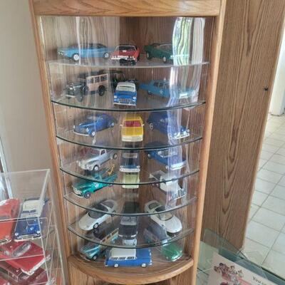 display case with lots of die cast cars sold separately