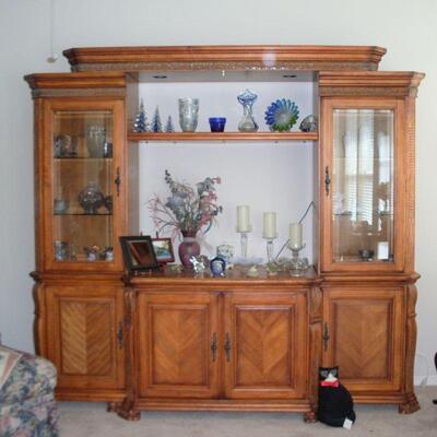 ENTERTAINMENT CENTER CAN BE DIVIDED INTO PIECES THE TWO TALL PIECES CAN BE PUT TOGETHER FOR A CHINA CABINET AND THE CENTER PIECE CAN BE A...