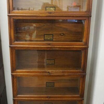1106	OAK SECTIONAL BARRISTER BOOKCASE, GLOBE WERNICKE, 5 SECTION, CUSTOM MADE BASE, APPROXIMATELY 34 IN X 11 IN X 76 IN HIGH
