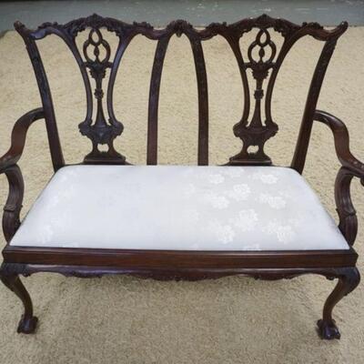 1125	CHIPPENDALE STYLE DOUBLE WIDE SETTEE BALL & CLAW FEET HAS A SPLIT IN THE CARVING IN THE BACK ON ONE SIDE & SOME STAINING ON THE...