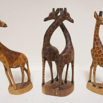 1201	GROUP OF 3 WOODEN CARVED GIRAFFES
