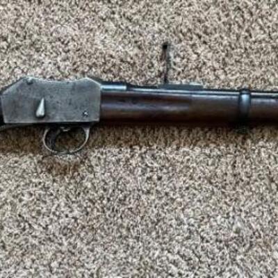 Item# 106 
   This is an Antique British made Isahapore Martini-Henri carbine rifle made for military use. 
   This is serial #4025;...