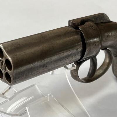 Item  # 112  Antique 5 shot Bar Hammer Pepperbox Revolver 


     This antique bar hammer Pepperbox pistol was manufactured sometime...