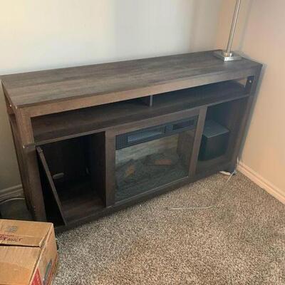 $360 Electric Fireplace for beauty and/or heat. Entertainment center, Various settings includes remote. 