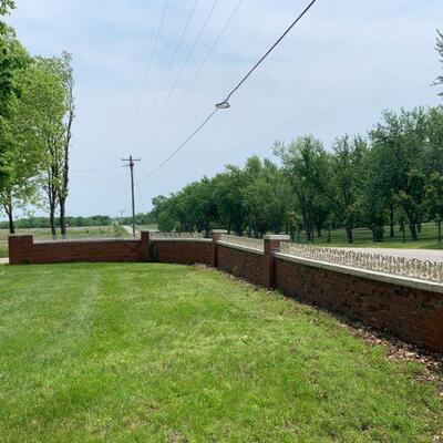 wrought iron on brick fence wall 
