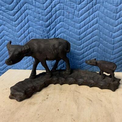 Wooden carved cow with calf 