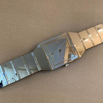 mirrored wall clack in the shape of a watch by Sharon Collections, 1980s