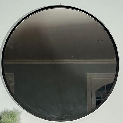 CIRCLE WALL MIRROR | Large wall mirror of simple design with a black frame; approx dia. 37-1/4 in.