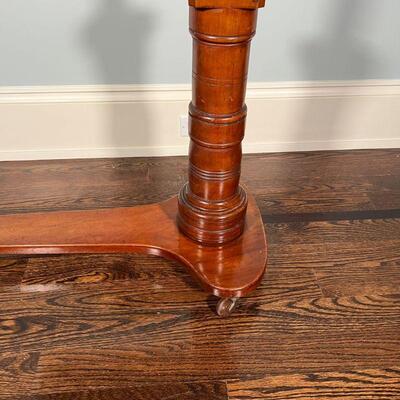 ANTIQUE WOOD EASEL | Antique easel on casters, adjustable height on a carved column; h. 45 x w. 29-1/2 x d. 16 in.