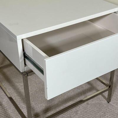 WEST ELM BEDSIDE STAND | White lacquered drawer and case on a chrome frame; h. 22 x 20 x 22 in.