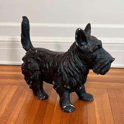 PAINTED DOG FIGURE | Small black schnauzer, black painted composition; h. 14-3/4 x w. 18-1/2 x d. 8 in. [one front foot cracked, with...